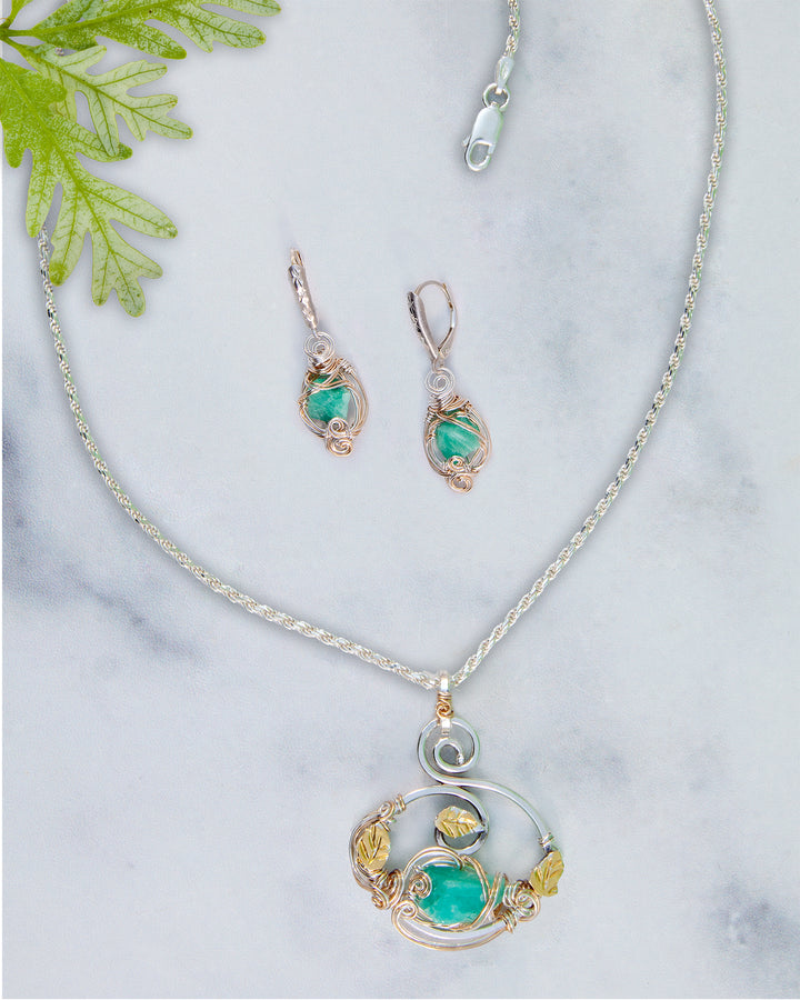 Jewelry set with necklace and earrings on a marble surface